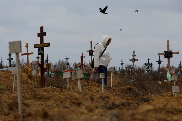 <p>A woman visits a cemetery, in the course of Russia-Ukraine conflict in the settlement of Staryi Krym outside Mariupol, Russian-controlled Ukraine, November</p>