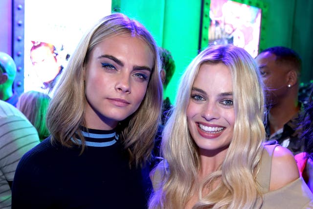 <p>Cara Delevingne and Margot Robbie of ‘Suicide Squad’ attend the Samsung Experience at San Diego Comic-Con 2016</p>