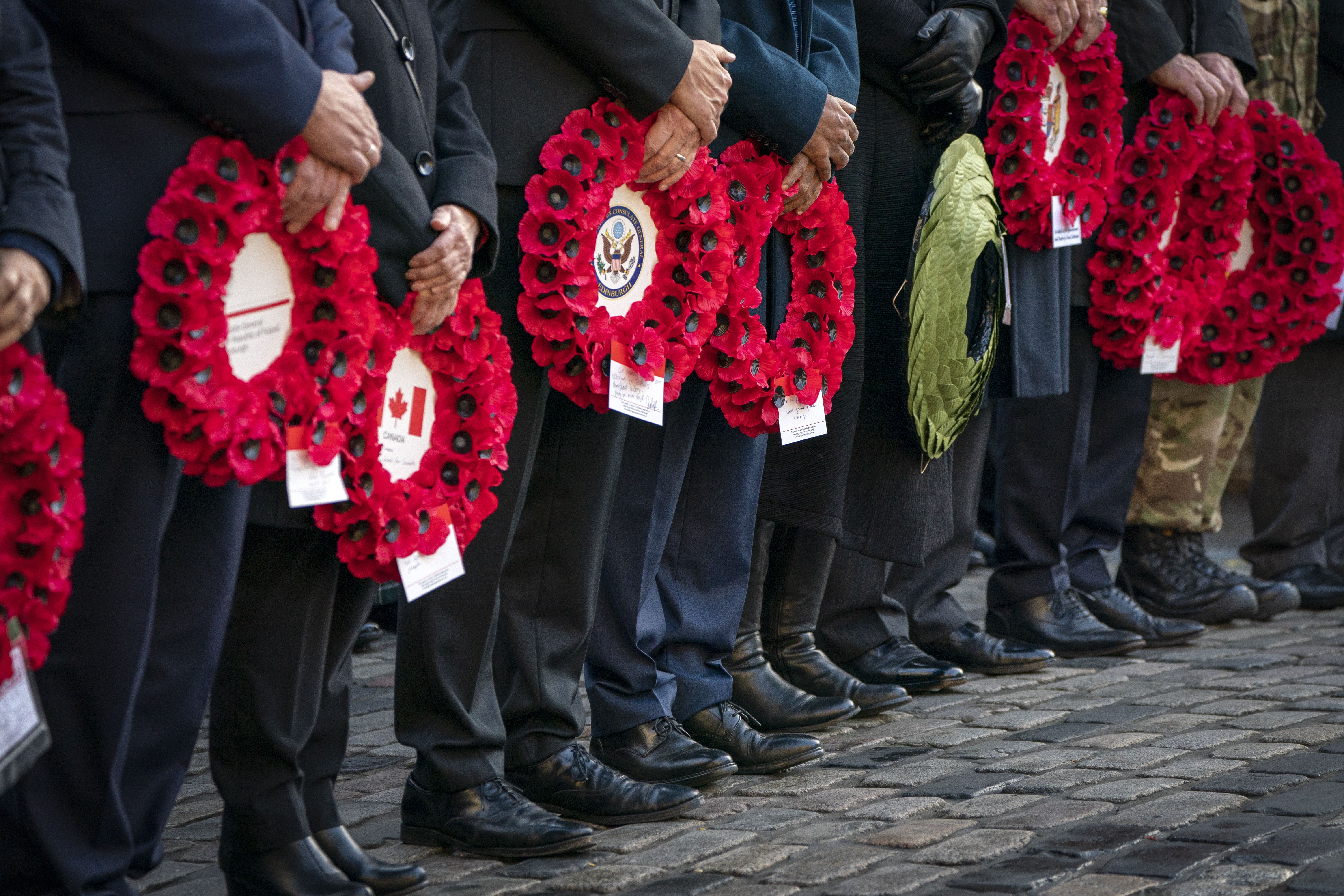 Dignitaries and members of the Armed Forces placed poppy wreaths at the Stone of Remembrance in Edinburgh (Jane Barlow/PA)