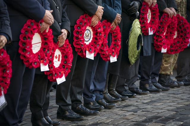 <p>Dignitaries and members of the Armed Forces placed poppy wreaths at the Stone of Remembrance in Edinburgh last year (Jane Barlow/PA)</p>