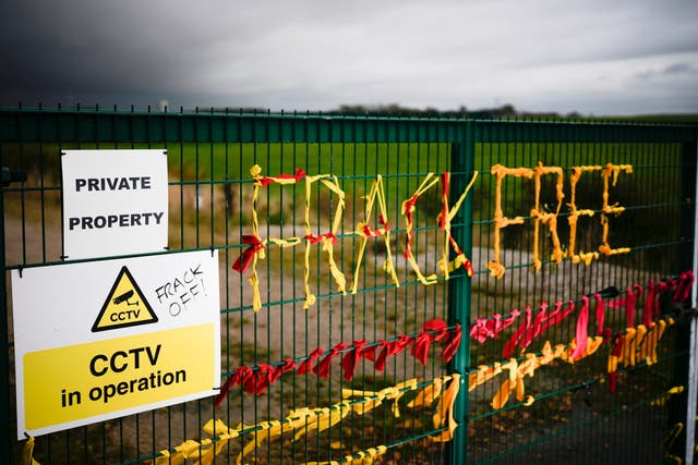 <p>Ribbons threaded through a gate read ‘Frack Free’, at shale gas firm Cuadrilla’s Preston New Road site, Lancashire, in October 2022</p>
