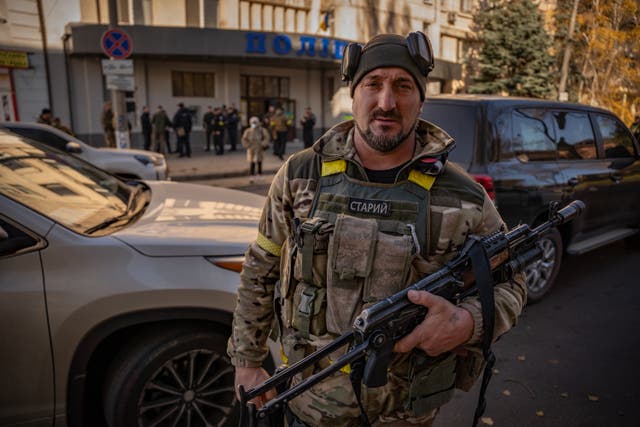 <p>Serhiy Volodkitch outside the Kherson police headquarters on Monday</p>