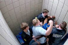 Georgia sheriff investigates jailers shown punching detainee