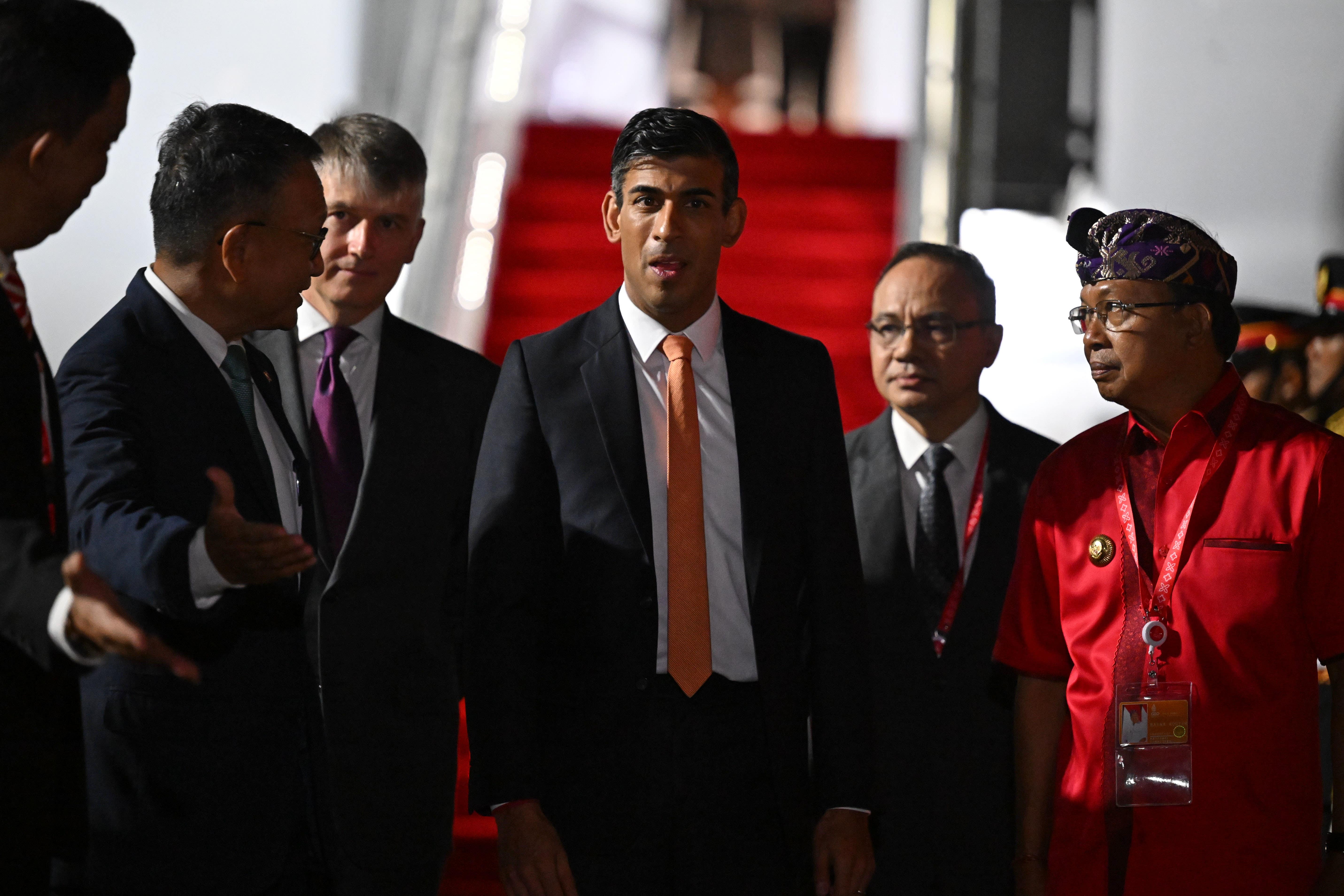 Prime Minister Rishi Sunak (centre) arrives at Ngurah Rai International Airport ahead of the G20 in Bali, Indonesia. Picture date: Monday November 14, 2022.