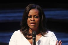 Michelle Obama tears up describing the lessons she learned from her late father