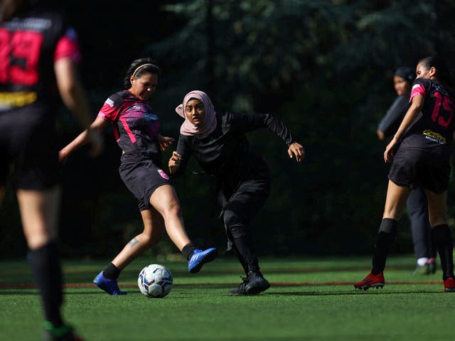 <p>Sisterhood FC player Atiya in action during a Ladies Super Liga 7-a-side tournament match </p>