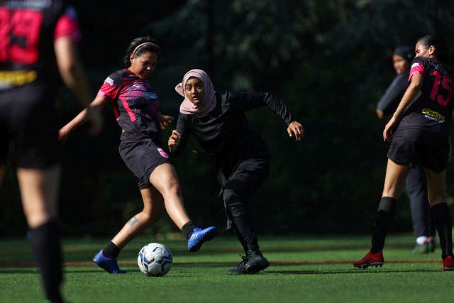 <p>Sisterhood FC player Atiya in action during a Ladies Super Liga 7-a-side tournament match </p>