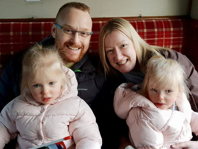 <p>Jamie Buchanan, pictured with his wife and twin daughters, recently celebrated six years of remission </p>