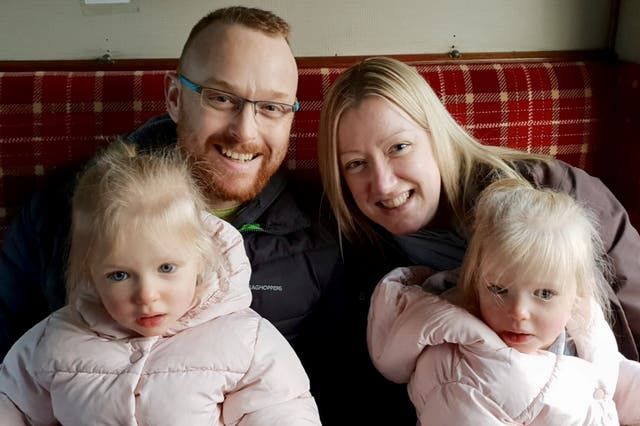 <p>Jamie Buchanan, pictured with his wife and twin daughters, recently celebrated six years of remission </p>
