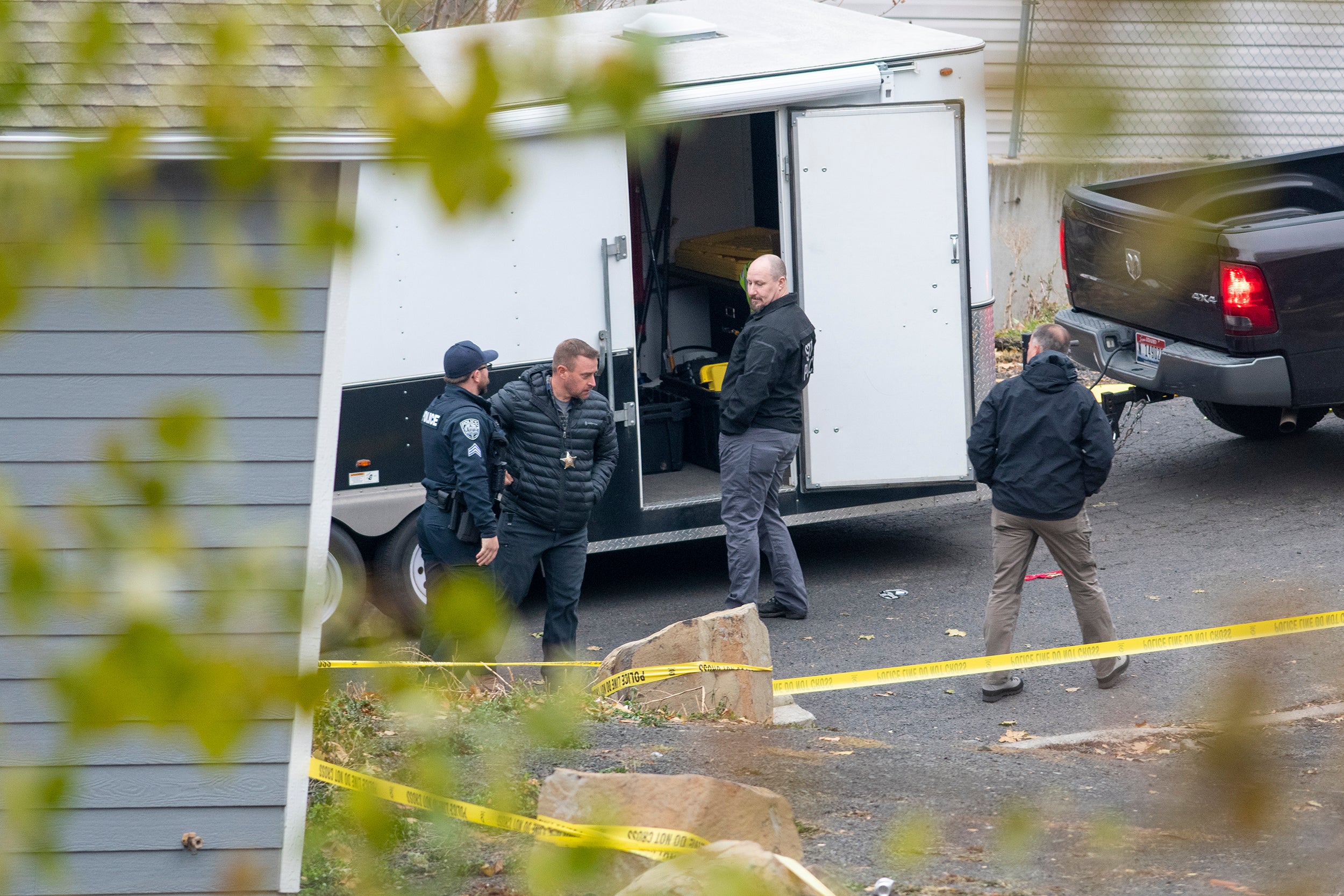 Police officers on the scene of the quadruple murders in Moscow, Idaho