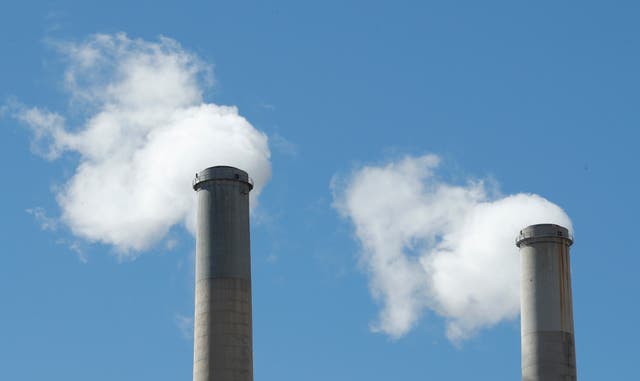 <p>Smoke comes out of a coal-fired power plant in Utah in 2017. A recent survey found that many Americans still belief a significant number of falsehoods about the climate crisis</p>