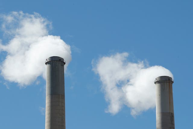 <p>Smoke comes out of a coal-fired power plant in Utah in 2017. A recent survey found that many Americans still belief a significant number of falsehoods about the climate crisis</p>