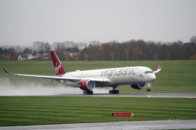 Virgin Atlantic’s gender-neutral uniform policy did not apply onboard the England football team’s flight to Qatar ‘to ensure the safety of our people’, the airline said (Joe Giddens/PA)