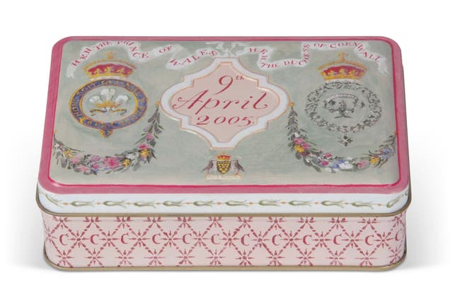 A piece of cake from the wedding of the King and Queen Consort is to be sold at auction and comes in a souvenir tin (Newman Associates PR/PA)