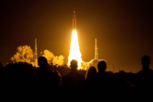 <p>File photo: Spectators watch as the Artemis I unmanned lunar rocket lifts off from launch pad 39B at NASA's Kennedy Space Center </p>