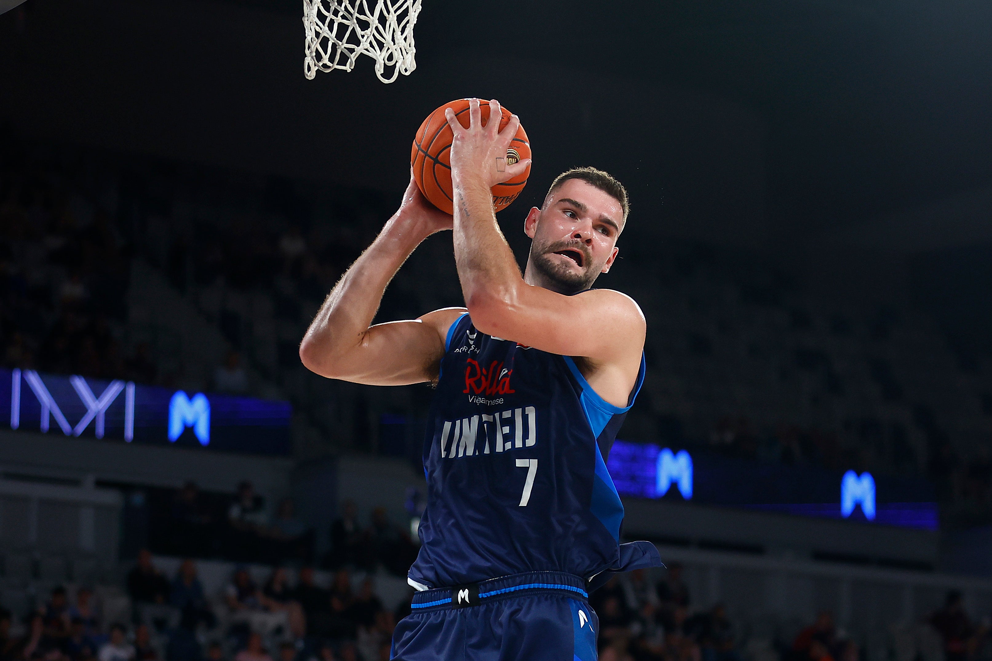 Isaac Humphries of United rebounds during a NBL match