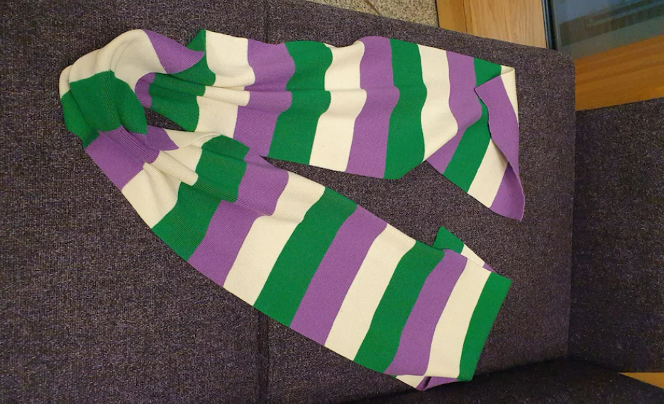 White, purple and green are colours typically associated with the suffragette movement