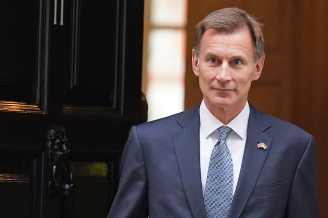 Chancellor of the Exchequer Jeremy Hunt leaves 11 Downing Street, London, for the House of Commons to deliver his autumn statement (Stefan Rousseau/PA)