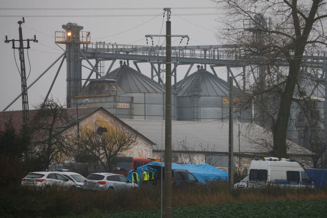 <p>Police at a grain depot where an explosion killed two people in Przewodow</p>