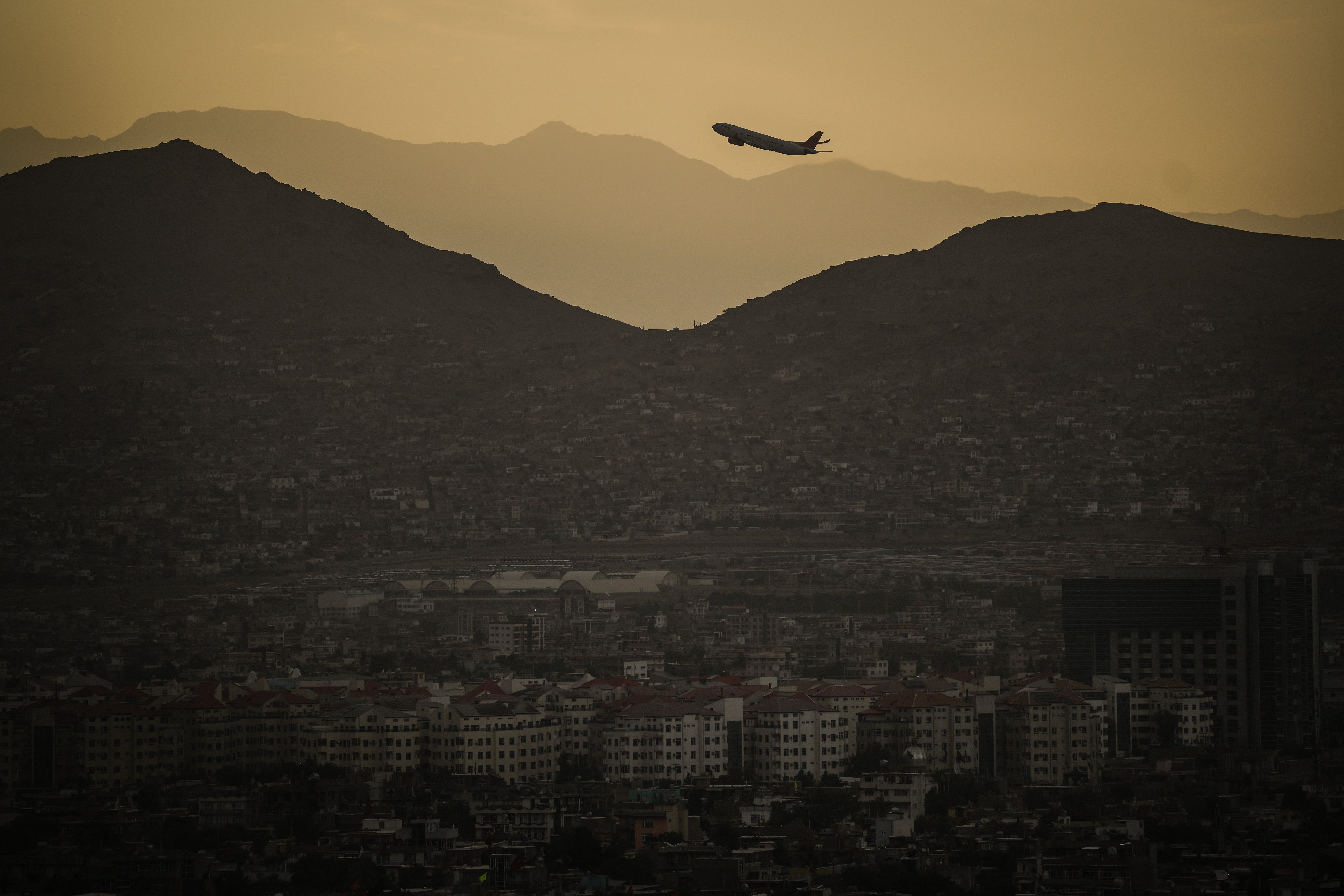 A plane takes off from Hamid Karzai International airport in Kabul, Afghanistan