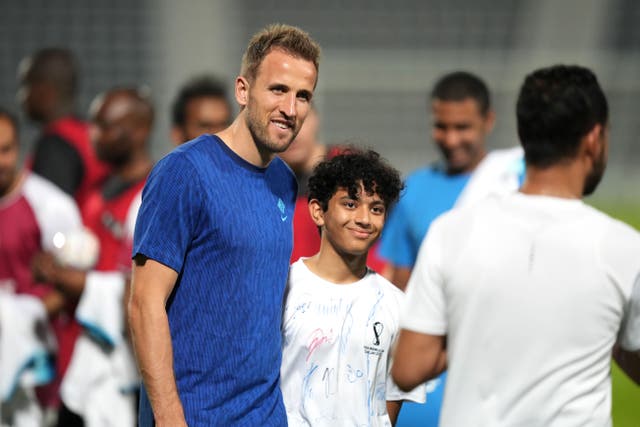 England captain Harry Kane posed for photographs during a Community Engagement event at the World Cup in Qatar (Martin Rickett/PA)