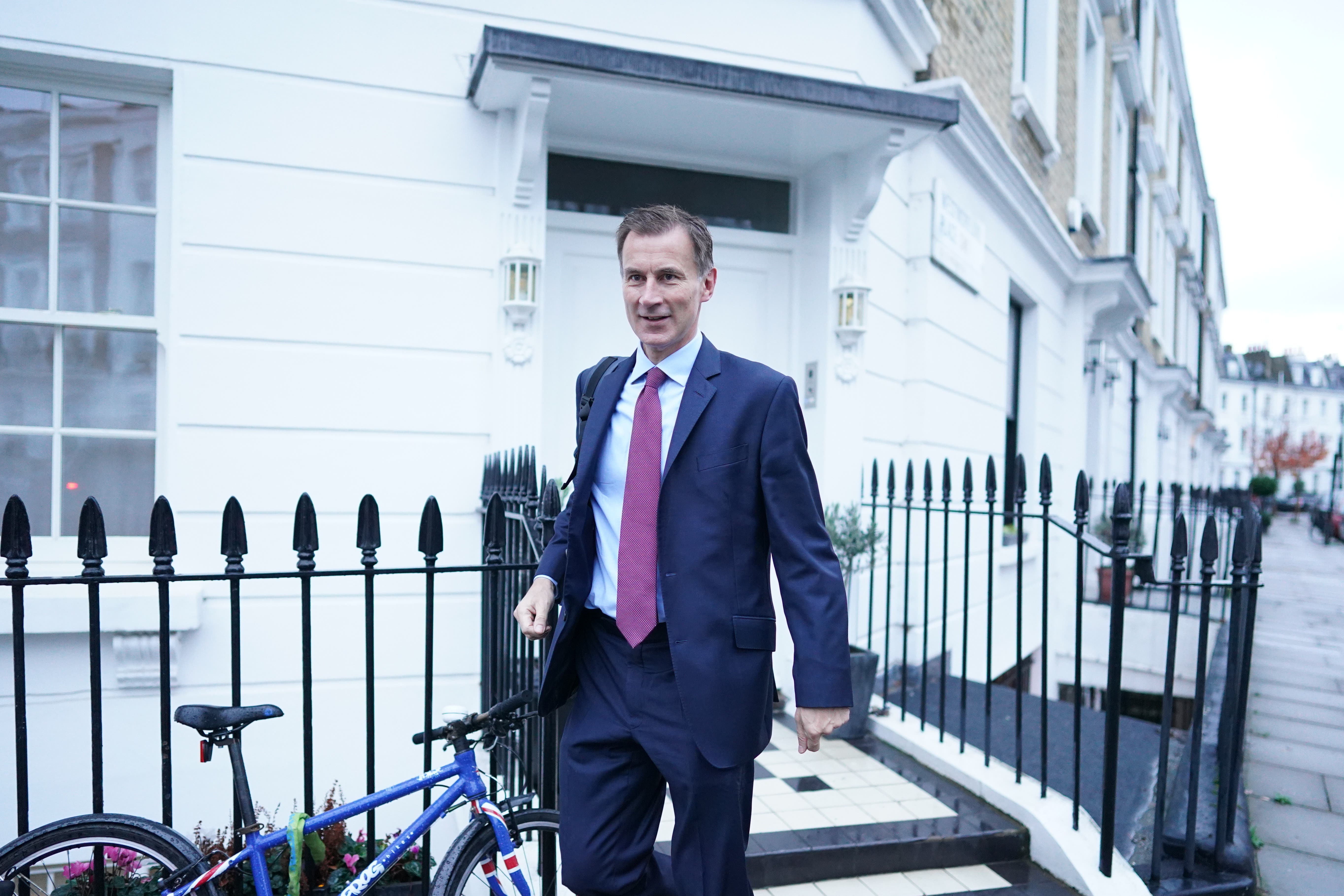 Chancellor of the Exchequer Jeremy Hunt leaves his home in London as he prepares to delivery his autumn statement (Stefan Rousseau/PA)