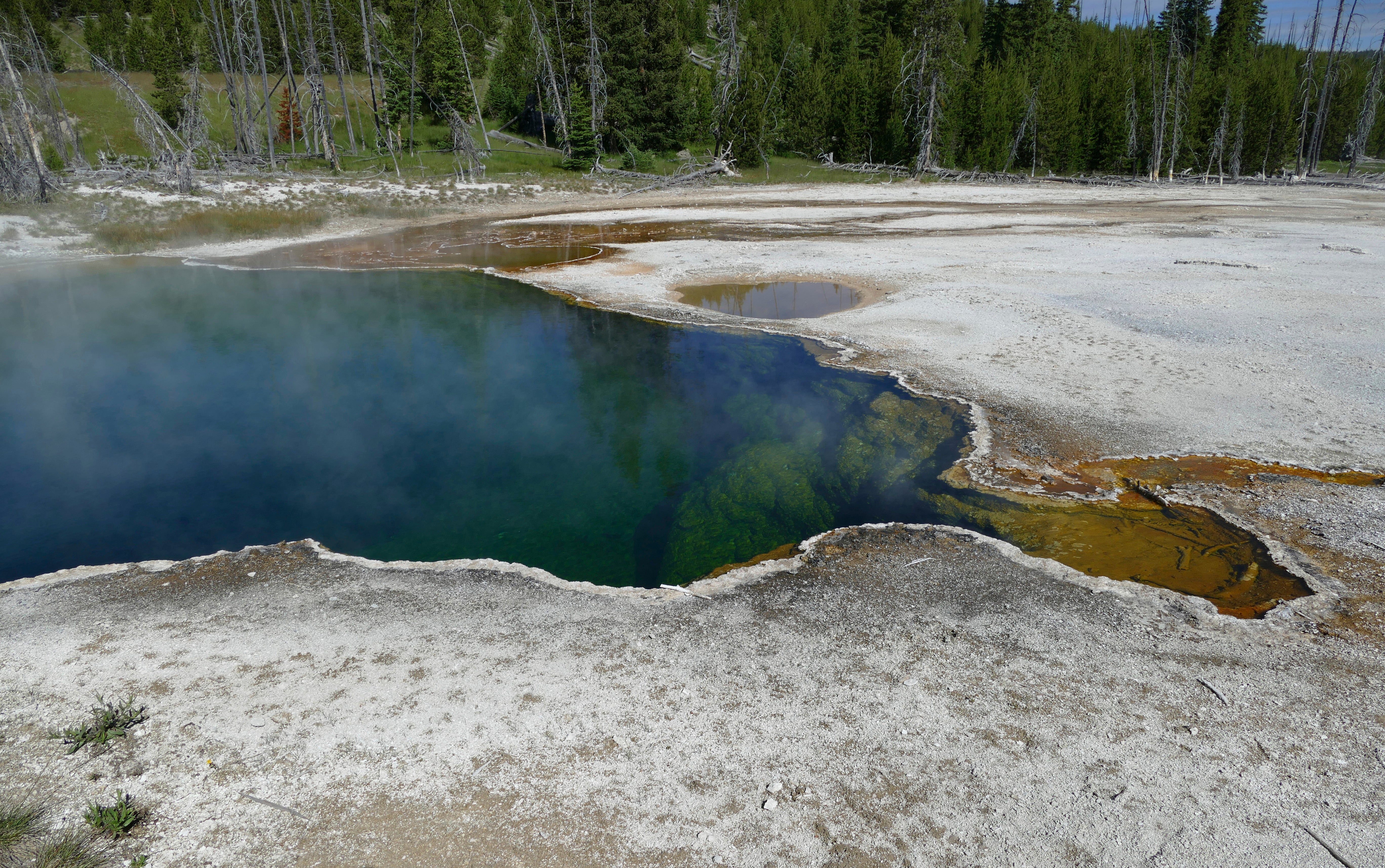 FILE - In this photo provided by the National Park Service is the Abyss Pool hot spring in the southern part of Yellowstone National Park, Wyo., in June 2015.