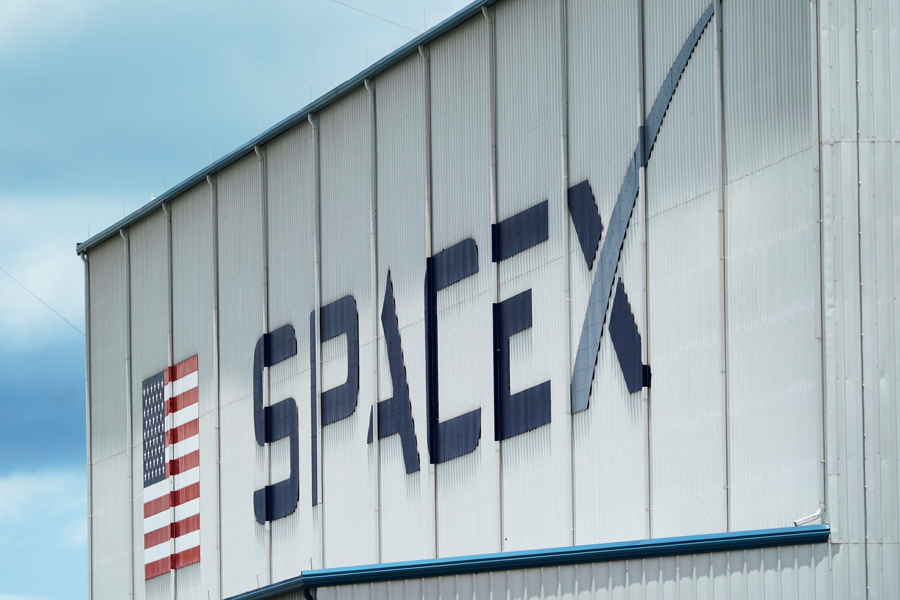 The SpaceX logo is displayed on a building on 26 May, 2020, at the Kennedy Space Center in Cape Canaveral, Florida