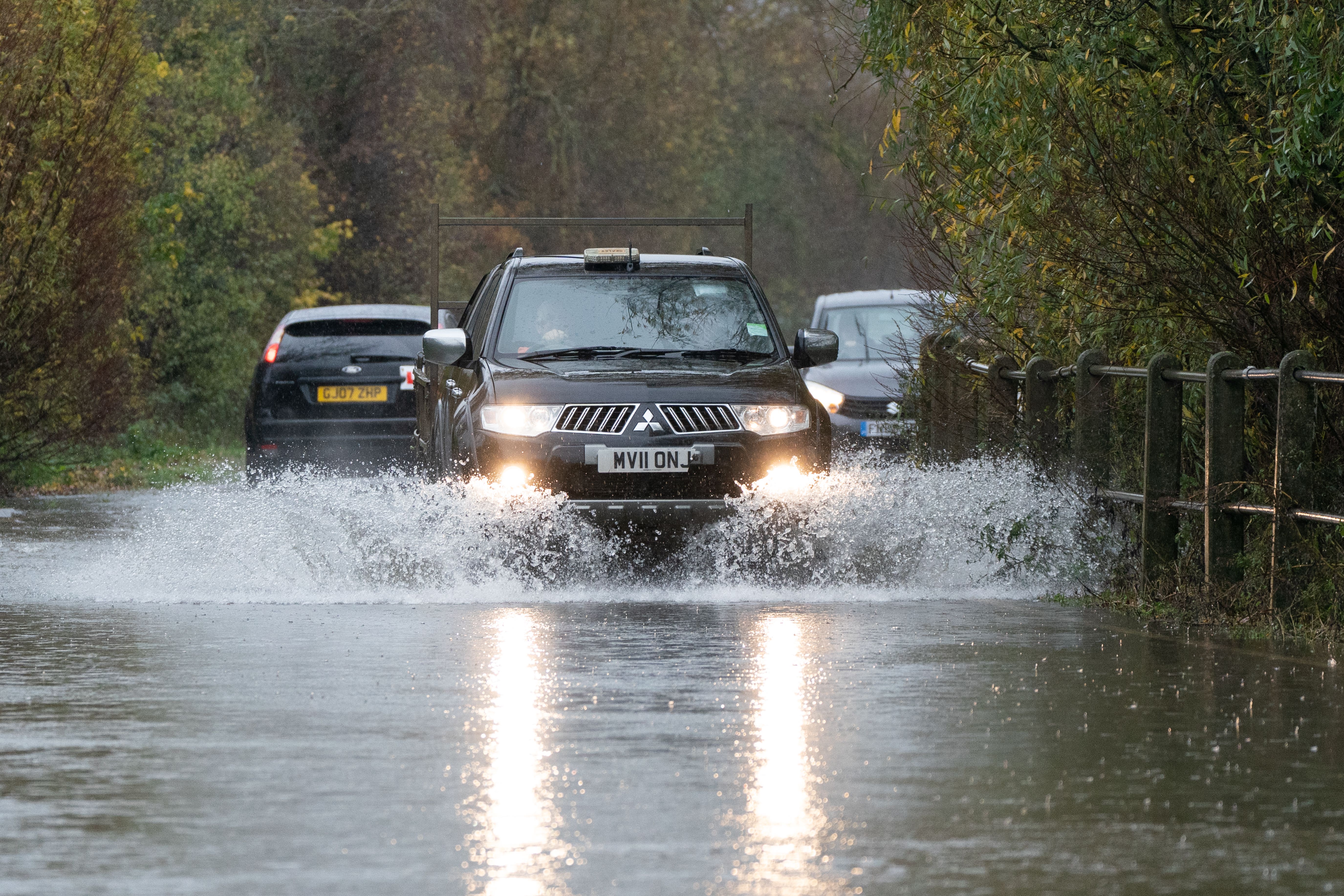 A motorist drives along a flooded road in Mountsorrel, Leicestershire (Joe Giddens/PA)
