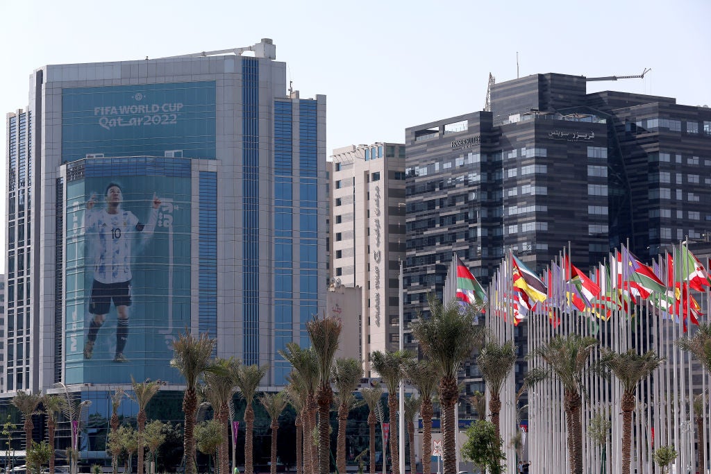 A giant image of Messi is displayed on a building in Doha