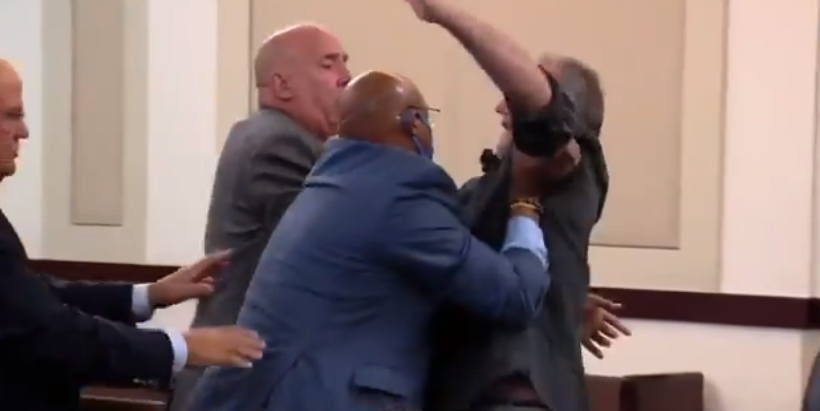 Rick Kaufman, the father of Caitlyn Kaufman, is escorted from a Nashville courtroom by deputies after he lunged at a partition toward Devaunte Lewis Hill and James Edward Cowan, the men accused of killing his daughter in 2020