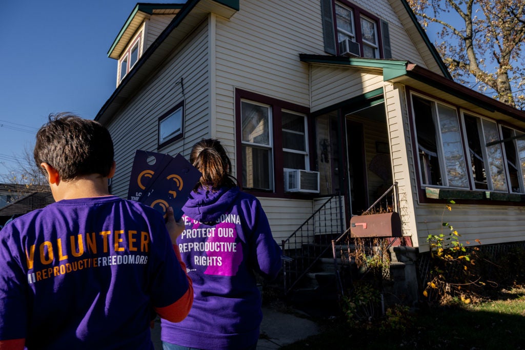 Canvassers visit a house in Dearborn, Michigan, as they campaign in support of a ballot measure enshrining the right to reproductive freedom
