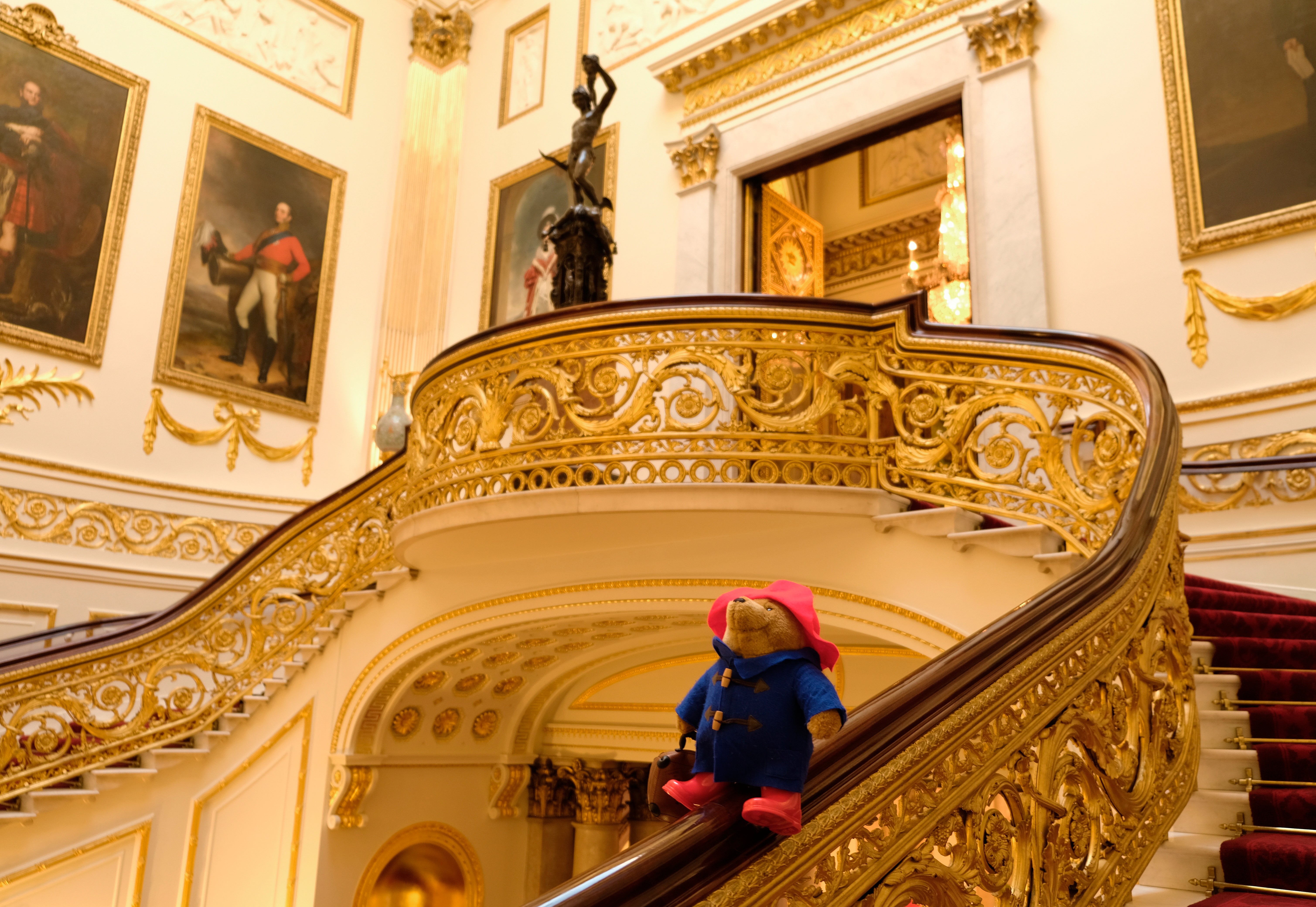 A Paddington bear on the Grand Staircase at Buckingham Palace in London