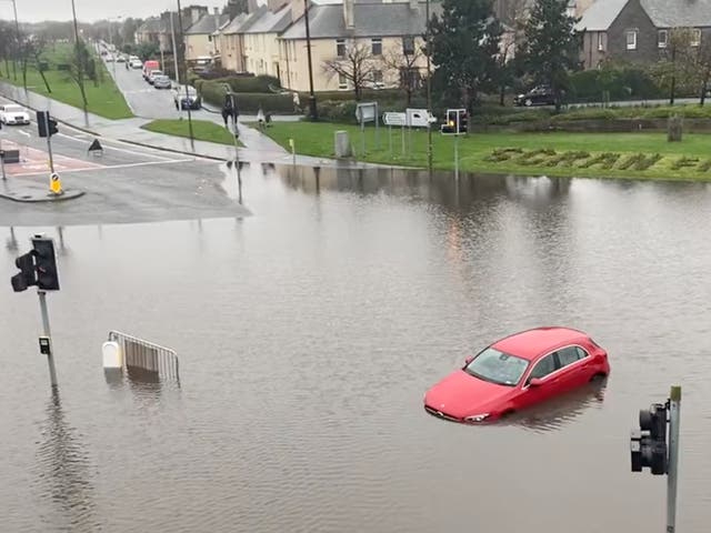 <p>Flooding at Edinburgh’s Crewe Toll junction on Friday</p>