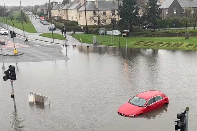 <p>Flooding at Edinburgh’s Crewe Toll junction on Friday</p>