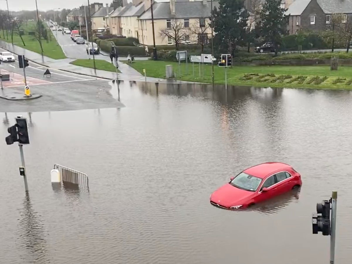 ‘Danger to life’ floods overwhelm homes, railways and roads in Scotland after 140mm of rain falls overnight