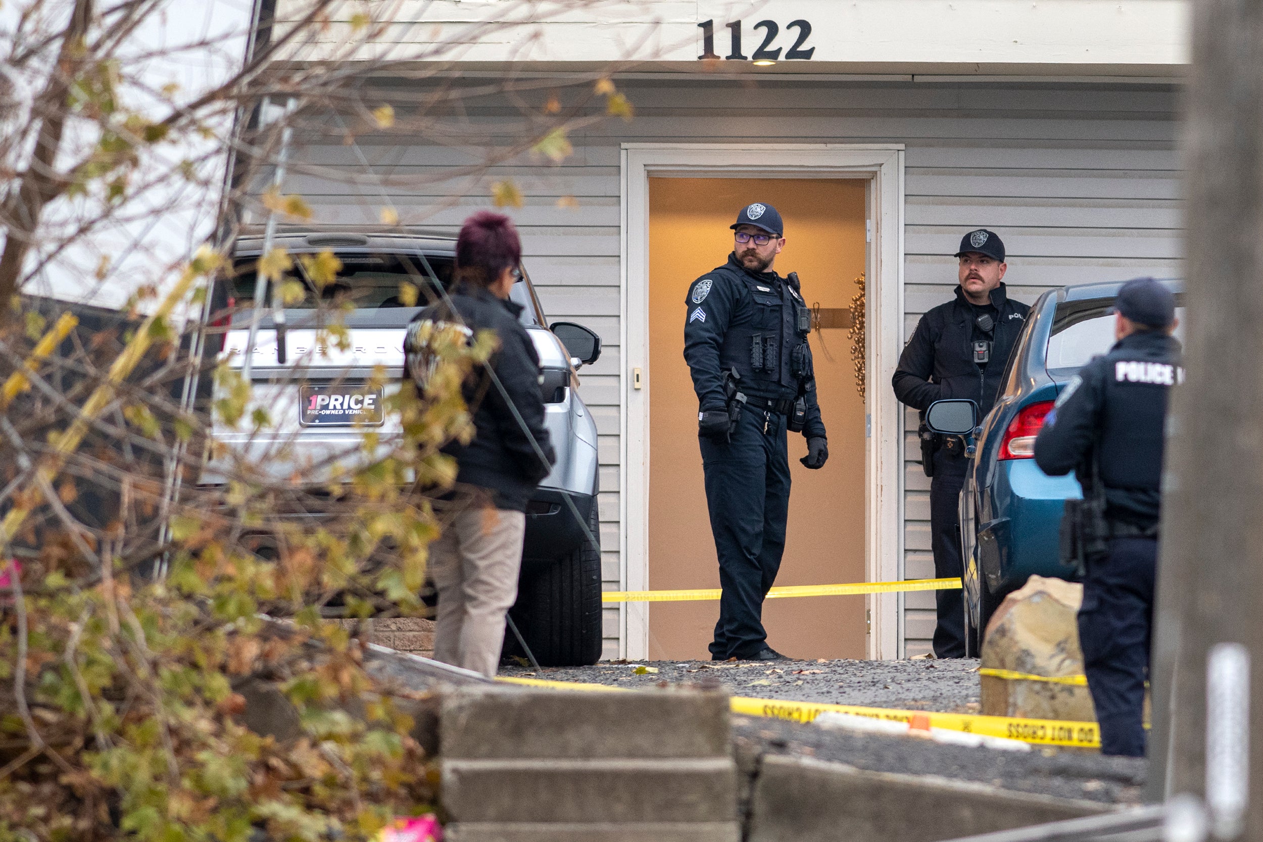 Officers on the scene of the off-campus student home where the murders took place
