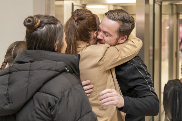 Scottish construction engineer Brian Glendinning with his wife and daughters after arriving at Edinburgh airport following his release after two months in an Iraqi jail (Jane Barlow/PA Wire)