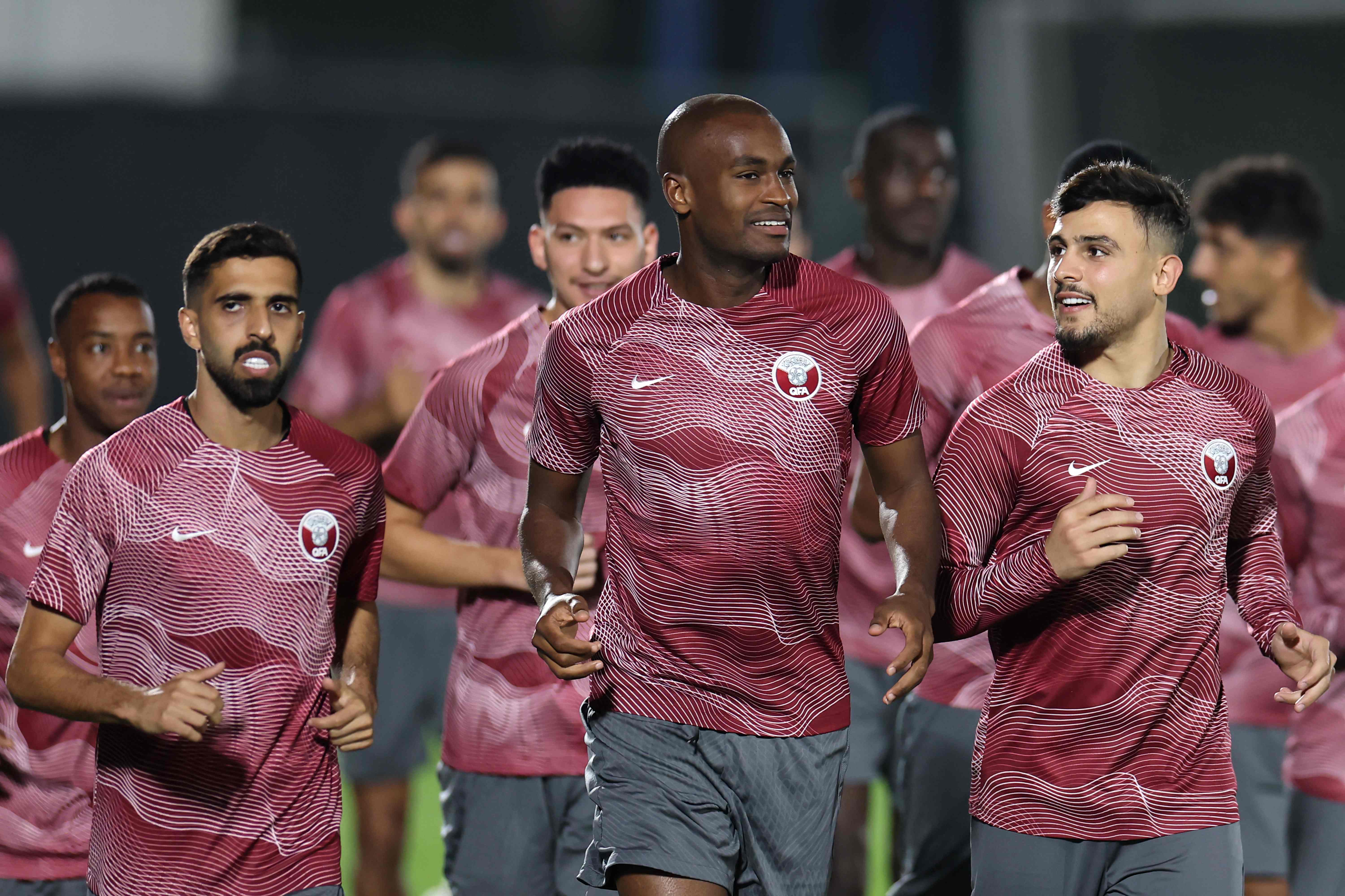 <p>Qatar defender Karim Hassan Abdel, centre, trains on the eve of the World Cup</p>