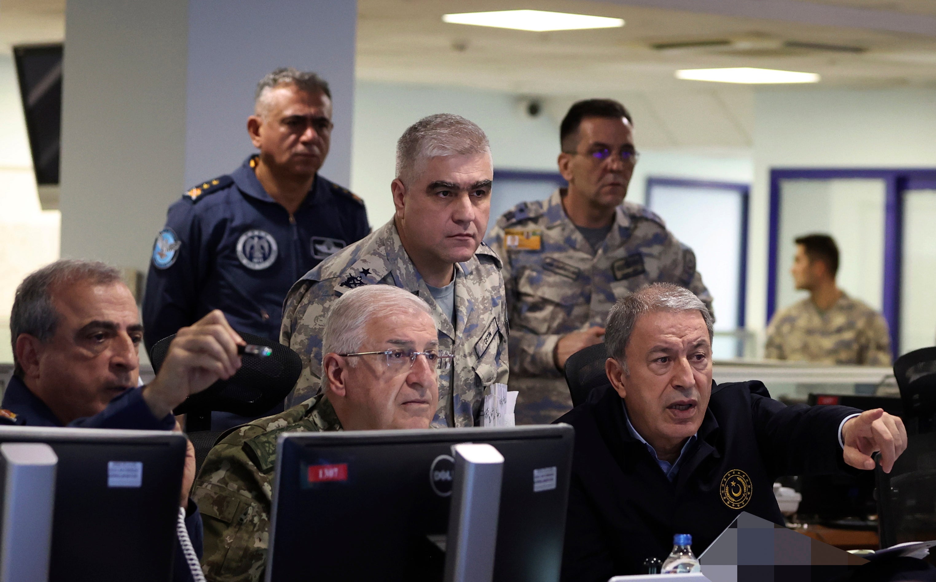 Defence minister Hulusi Akar, right, speaks to top army commanders at the air force command centre in Ankara