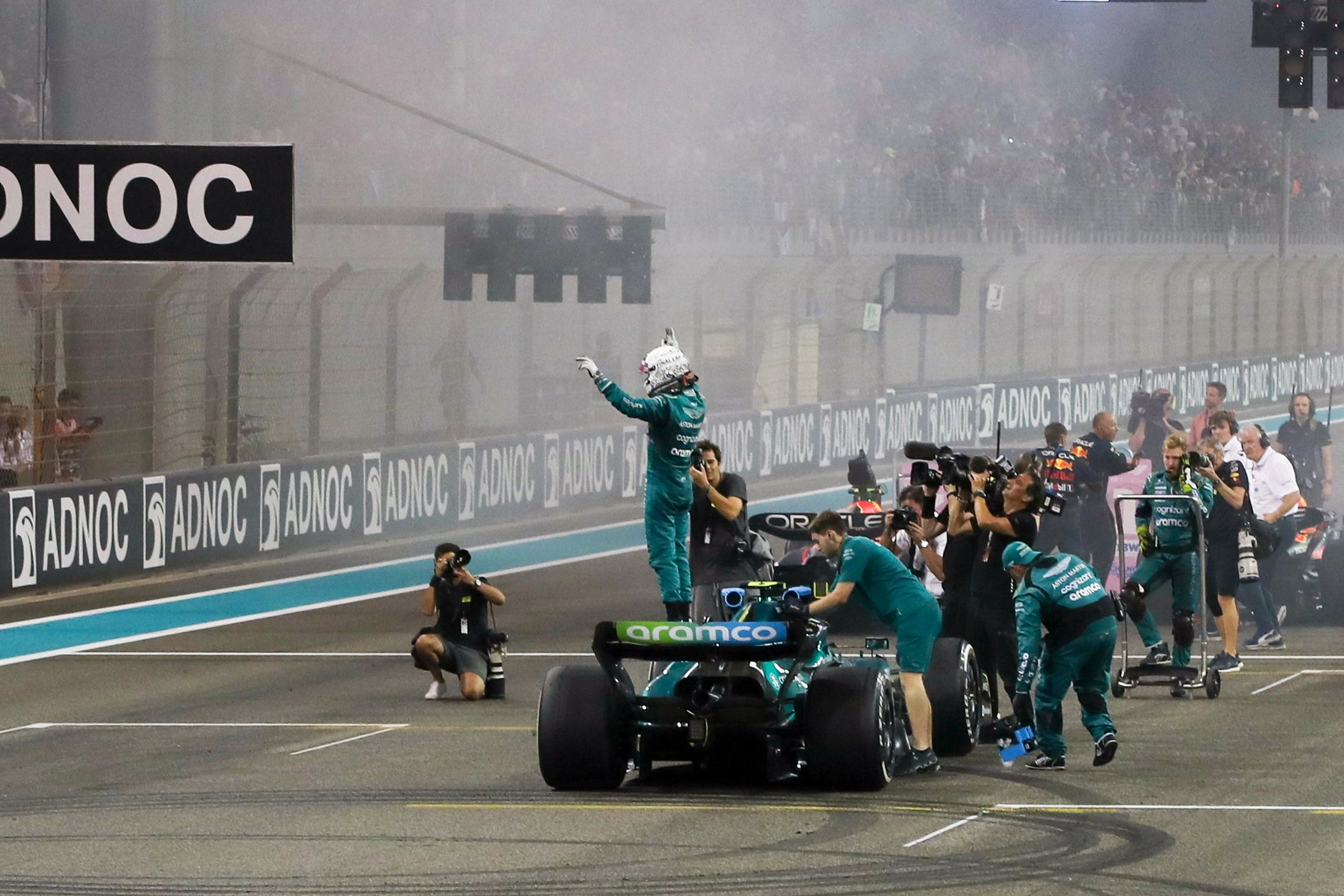Sebastian Vettel salutes fans after finishing his F1 career with a point in Abu Dhabi