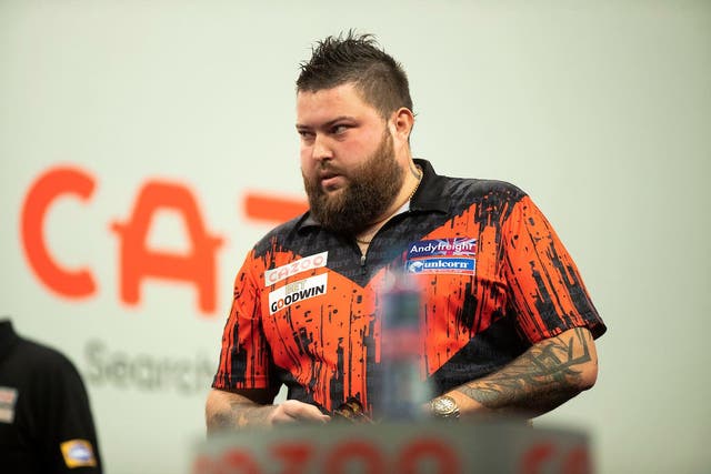 Michael Smith is into his ninth major final after beating Raymond Van Barneveld in the Grand Slam of Darts semi-final (Taylor Lanning/PDC)