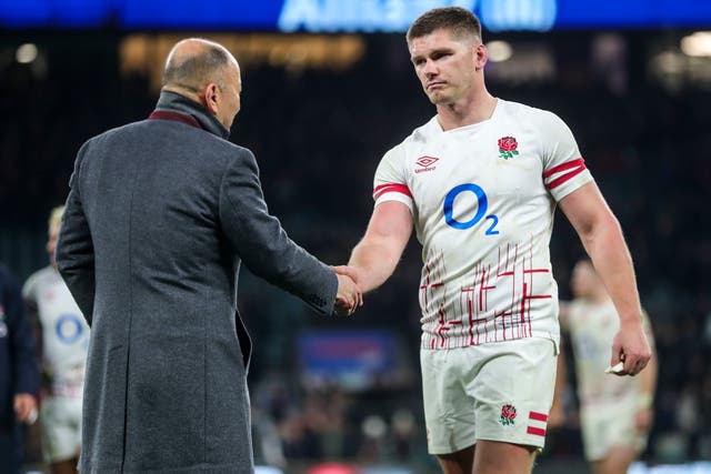 <p>Eddie Jones shakes hands with Owen Farrell at full-time</p>