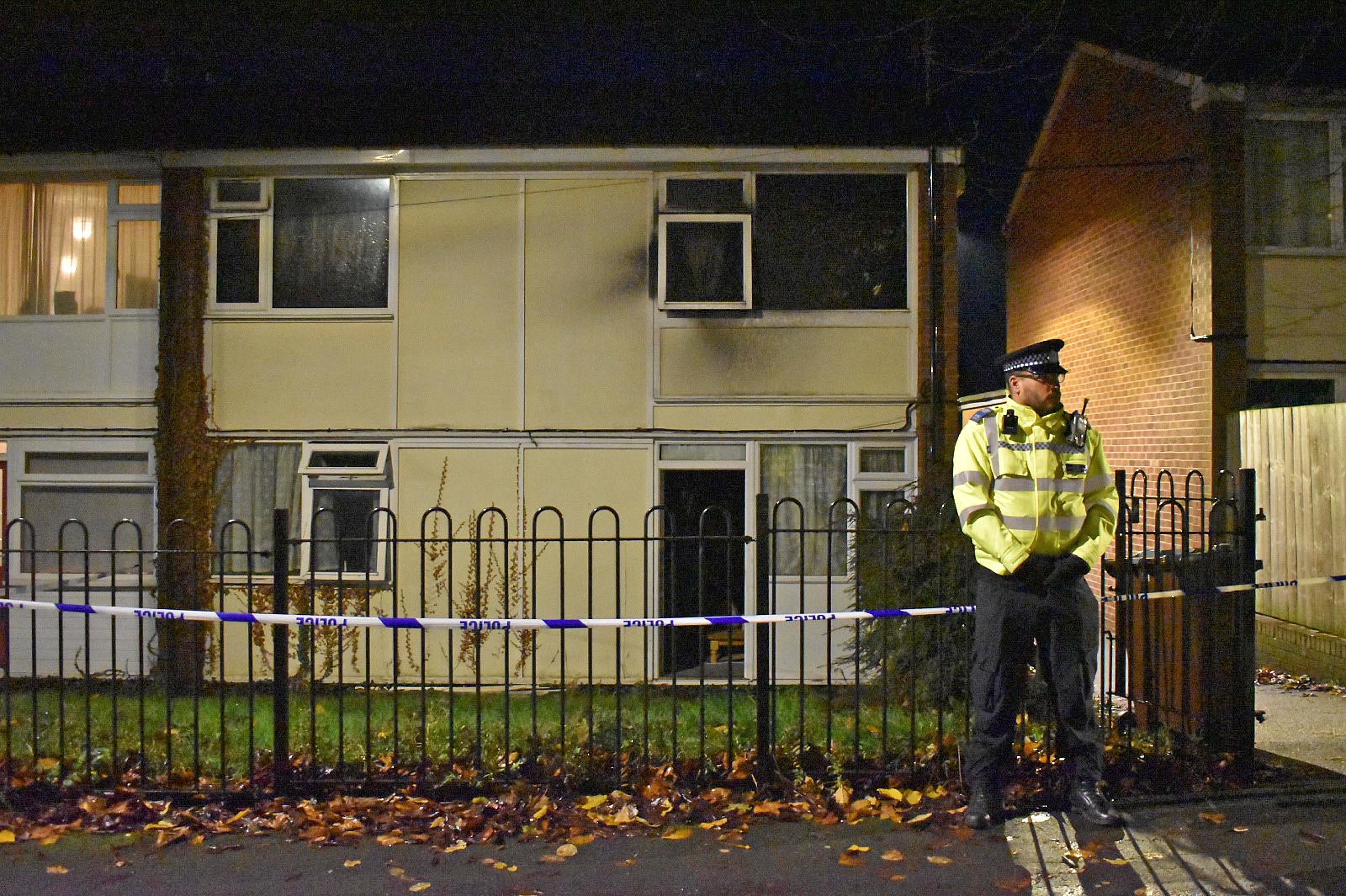 Police at the scene in Nottingham after two children died and a woman was left critically injured