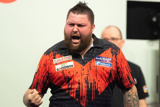 Michael Smith has won his first major title at the Grand Slam of Darts (Taylor Lanning/PDC)