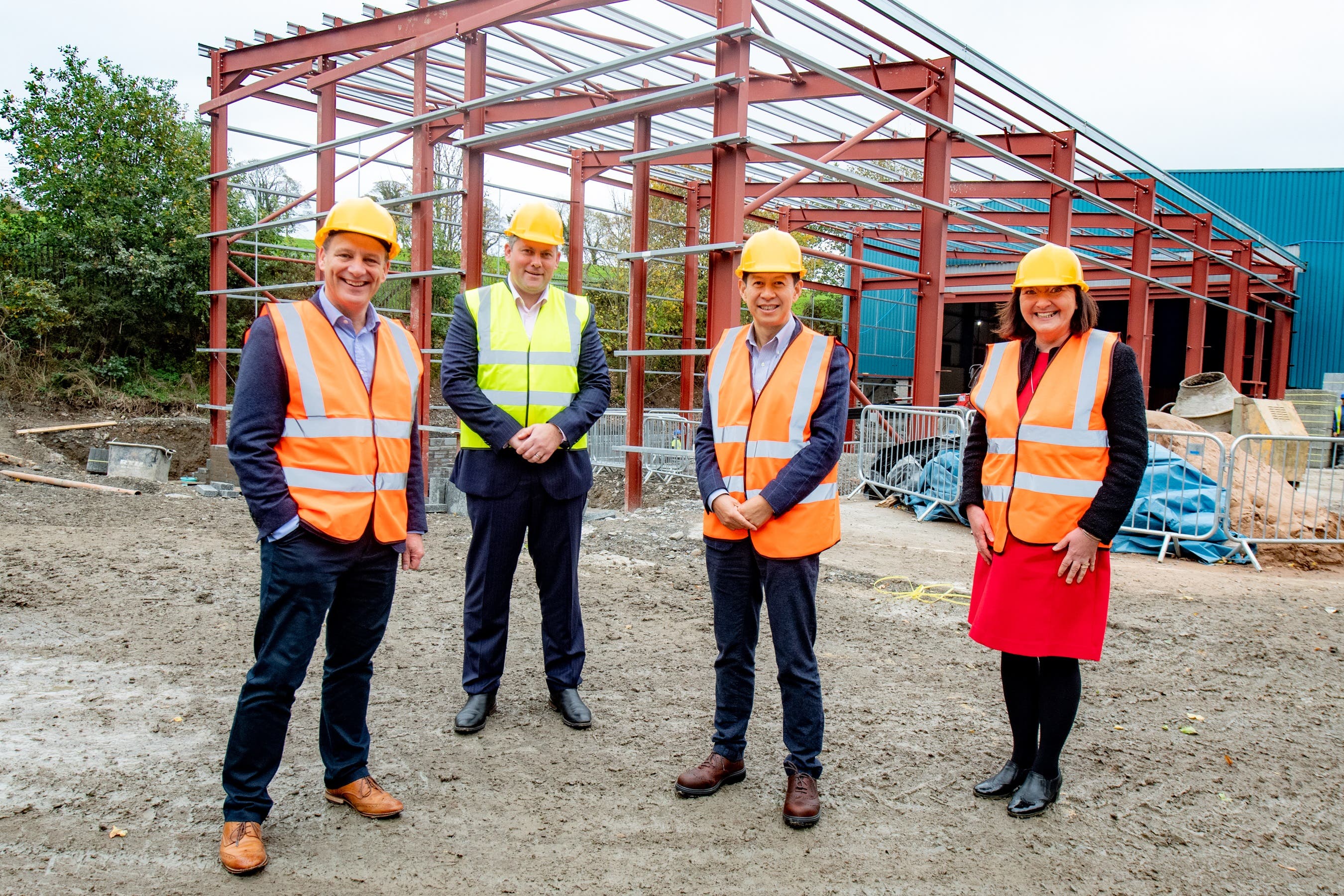 Jeremy Fitch, executive director of business growth, Invest Northern Ireland; Neil Taggart, CEO, Thompson Aero Seating;Tongyu Xu, Chairman, Thompson Aero Seating and Ethna McNamee, western regional manager, Invest Northern Ireland (PA)