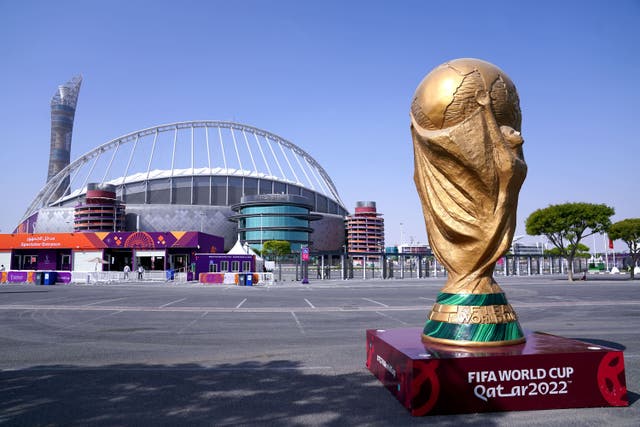A giant world cup replica outside the Khalifa International Stadium (Adam Davy/PA)