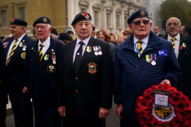 Nuclear test veterans wearing the ‘missing medal’ as they prepare to march along Whitehall for the Remembrance Sunday service at the Cenotaph in London. Picture date: Sunday November 13, 2022.