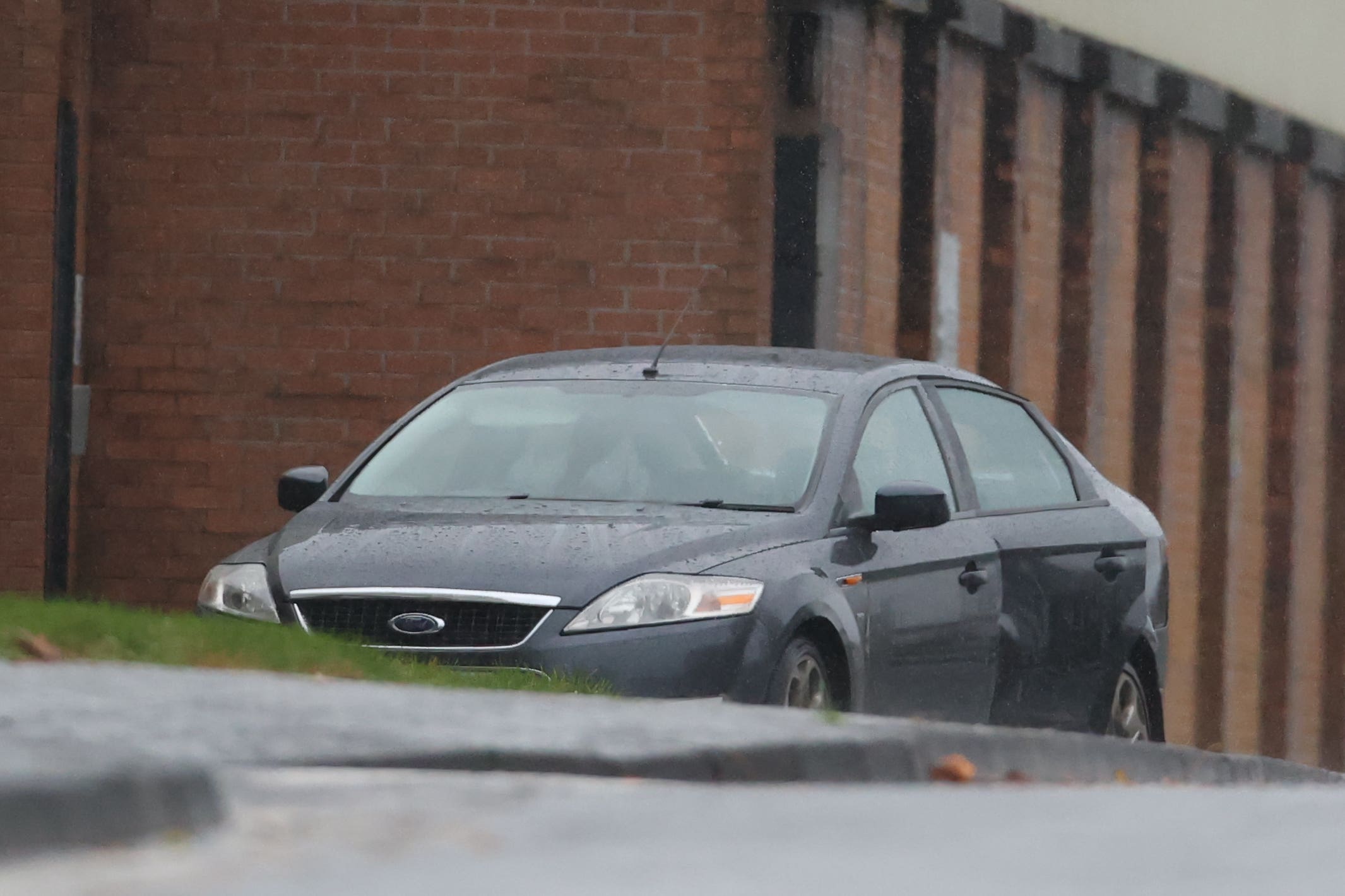 A car containing a suspect device is seen outside Waterside police station in Londonderry (Liam McBurney/PA)