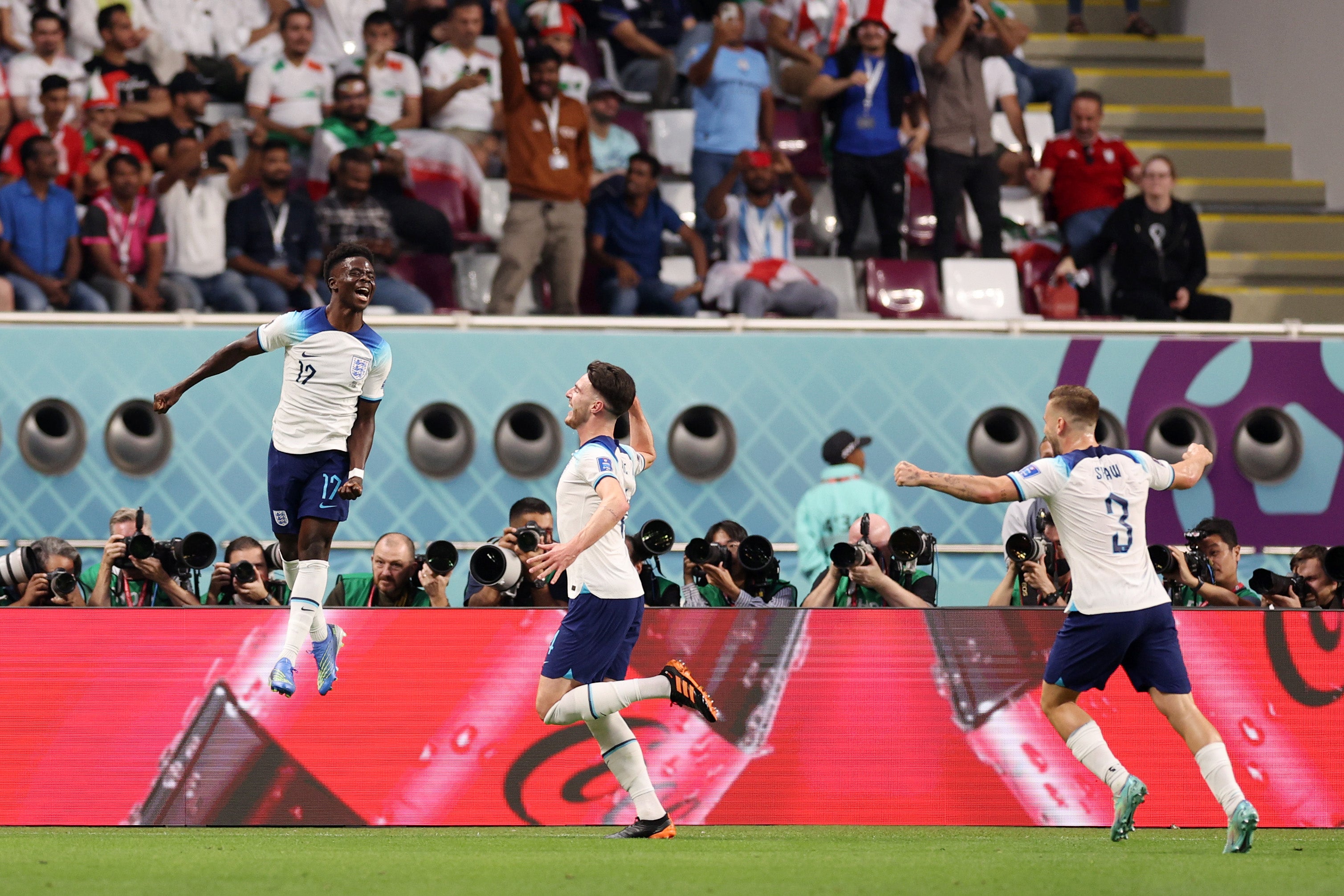 Saka wheels away to celebrate with Declan Rice and Luke Shaw